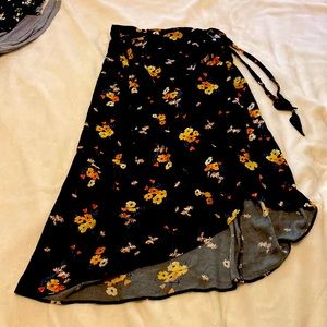 H&M size 10, black and floral wrap skirt with snap.